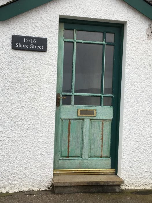 Scotland vs. America: Image of a celadon front door in Applecross.