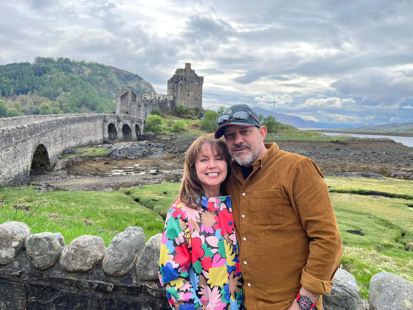 Scotland At Last: photo of couple in front of Eilean Donan Castle