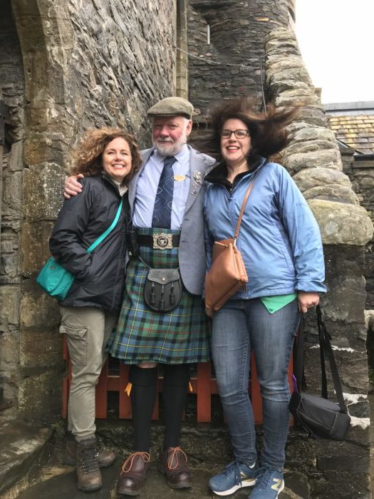 Scotland vs. America image of me, Megan Wright, and Eilean Donan castle volunteer, Mr. McCleod.