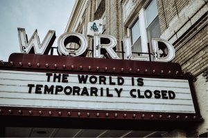 Everything Belongs: Image of a theater marquis saying: The World Is Temporarily Closed