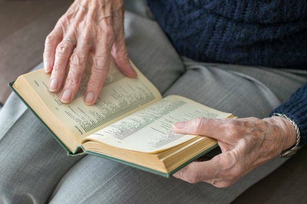 Learning How to Age Faith Matters Post: image of elderly woman's hands with Bible.