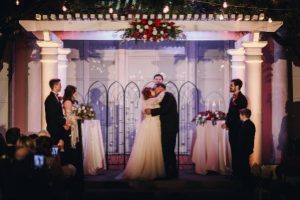 Love, look at the 2 of us: Image of bride and groom kissing