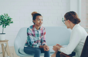 A female therapist and a young woman experiencing healing after child sexual abuse